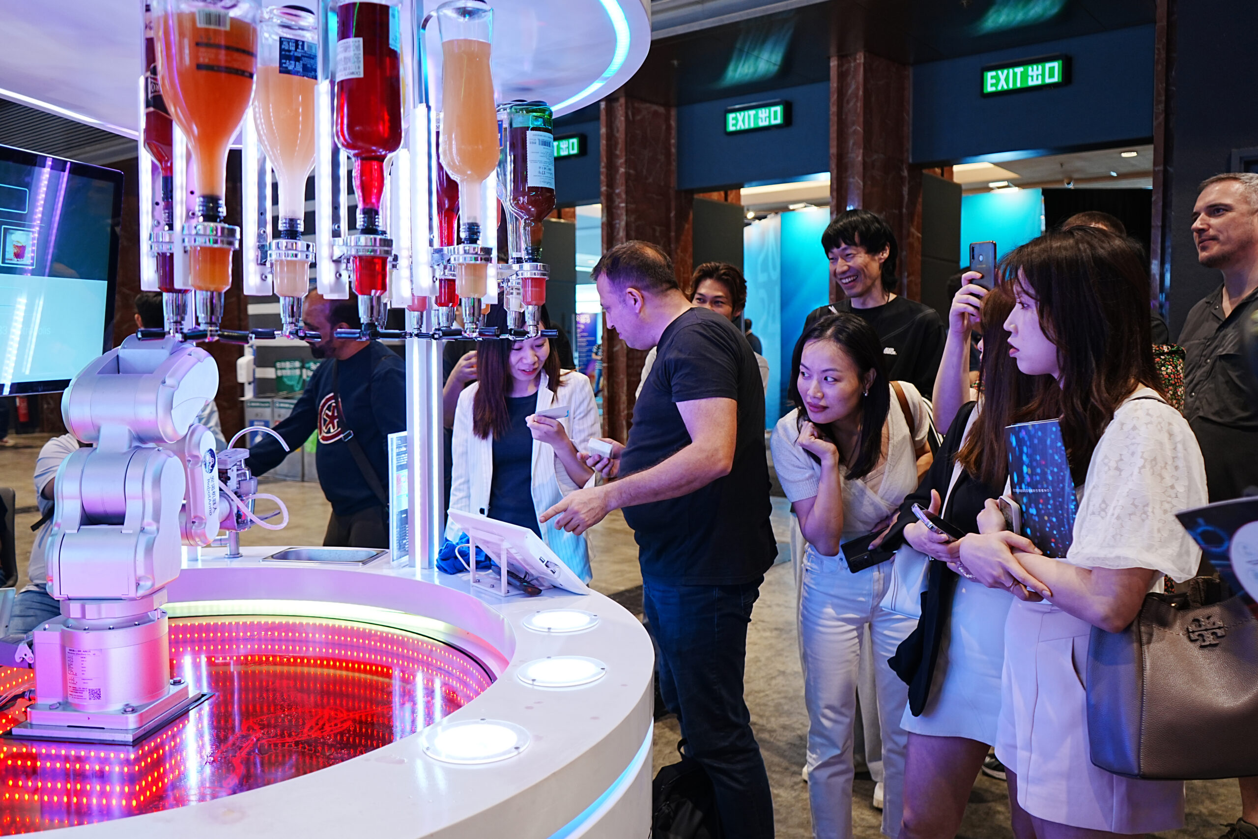 The bartender robot looks too cute to visitors!